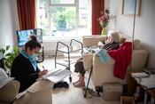 Elderly woman receiving care at home